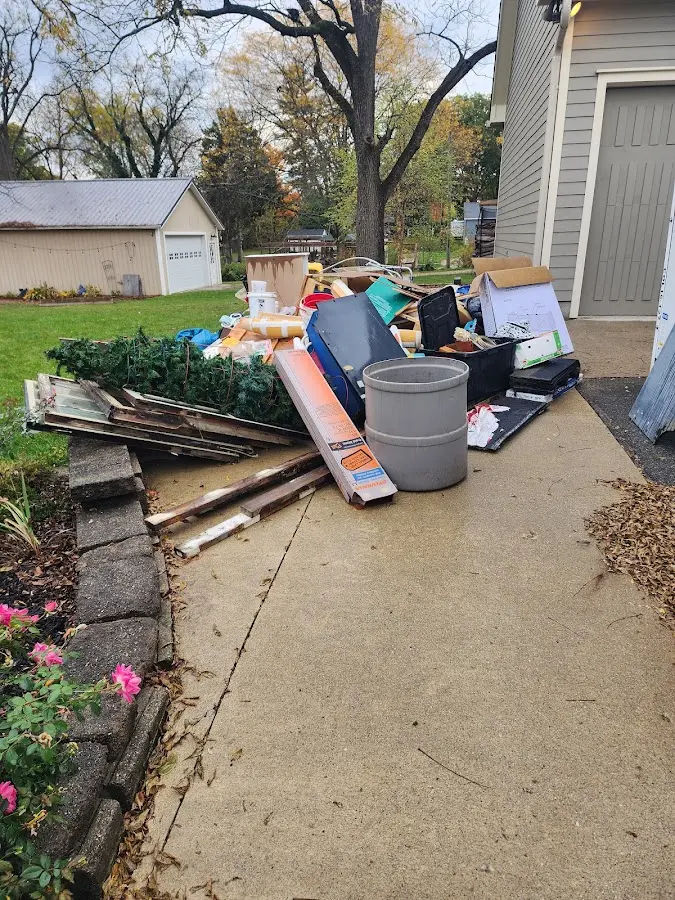 Dumpster being loaded with debris for Commercial Dumpster Rental in Flagler Estates